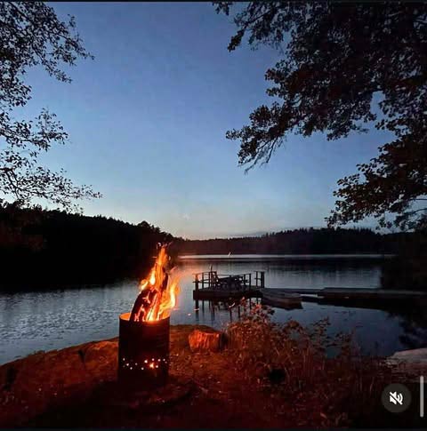 Evening campfire by the lake