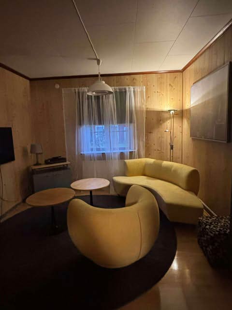 Cozy living room with yellow curved sofa