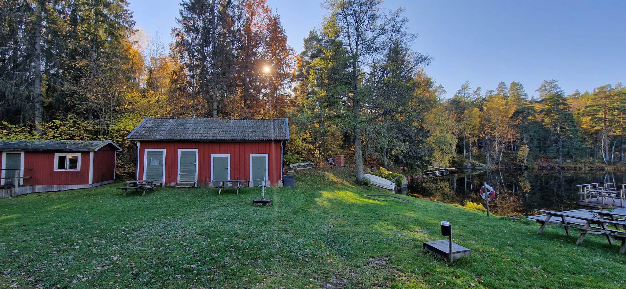 Autumn view of red buildings and lake